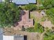 Aerial view of the house showcasing the roof, patio, and surrounding greenery at 11383 Pickford St, Spring Hill, FL 34609