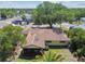 Inviting single-story home with screened porch, mature trees, and lush landscaping in a serene neighborhood at 11383 Pickford St, Spring Hill, FL 34609