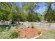 Charming backyard with seating area, lush landscaping, and a grill at 11383 Pickford St, Spring Hill, FL 34609