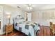 Comfortable bedroom with hardwood floors, neutral walls, and ample closet space at 11383 Pickford St, Spring Hill, FL 34609