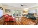 Relaxing living room with French doors, hardwood floors, and neutral decor at 11383 Pickford St, Spring Hill, FL 34609