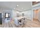 Kitchen with a large island, white cabinets, stainless steel appliances, and seating for three at 11407 Leland Groves Dr, Riverview, FL 33579