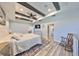 Spacious main bedroom with dark wood beam tray ceilings at 11407 Leland Groves Dr, Riverview, FL 33579