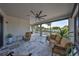 Enclosed patio with comfortable seating and a large window overlooking the pool at 11407 Leland Groves Dr, Riverview, FL 33579