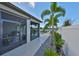 Pool and screened-in patio area with beautiful landscaping and lake views at 11407 Leland Groves Dr, Riverview, FL 33579