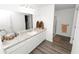 Bathroom features a white vanity with solid surface countertop and a glass enclosed shower at 11530 Adam Lee Way, Dade City, FL 33525