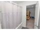 Bathroom features tub and shower combination and access to adjacent bedroom at 11530 Adam Lee Way, Dade City, FL 33525