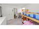 Cozy bedroom with a twin bed, closet, and adjacent bathroom access at 11530 Adam Lee Way, Dade City, FL 33525