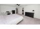 Spacious main bedroom with a ceiling fan, carpet flooring, walk-in closet, and ensuite bath at 11530 Adam Lee Way, Dade City, FL 33525
