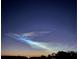Noctilucent clouds shimmer in the dark blue night sky at 11530 Adam Lee Way, Dade City, FL 33525