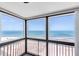Corner view from balcony offering panoramic vistas of ocean and beach with railings for safety at 1270 Gulf Blvd # 1904, Clearwater Beach, FL 33767