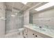 This bathroom features marble tile, glass enclosed shower, and a blue marble sink at 1270 Gulf Blvd # 1904, Clearwater Beach, FL 33767