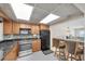 Traditional kitchen featuring stainless steel appliances, breakfast bar, and a tiled backsplash at 1270 Gulf Blvd # 1904, Clearwater Beach, FL 33767