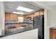 Efficient kitchen with stainless steel appliances, granite counters, and bright lighting, making meal prep a joy at 1270 Gulf Blvd # 1904, Clearwater Beach, FL 33767
