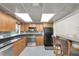 Well-equipped kitchen with stainless steel appliances, granite countertops, and custom cabinetry at 1270 Gulf Blvd # 1904, Clearwater Beach, FL 33767