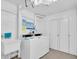 Functional laundry room with coin operated washer and dryer, and utility sink at 1270 Gulf Blvd # 1904, Clearwater Beach, FL 33767