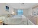 Bright main bedroom featuring neutral walls and access to a private balcony with ocean views at 1270 Gulf Blvd # 1904, Clearwater Beach, FL 33767