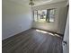 Bedroom featuring wood floors, natural light, and a closet for optimal storage at 12809 Wedgewood Way # A, Hudson, FL 34667
