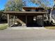Covered parking spaces under carport structure with unit numbers displayed at 12809 Wedgewood Way # A, Hudson, FL 34667