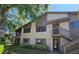 Two-story condo featuring a screened patio, private entrance, and well-maintained landscaping at 12809 Wedgewood Way # A, Hudson, FL 34667