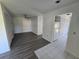 Bright living room featuring hardwood floors and fresh white paint at 12809 Wedgewood Way # A, Hudson, FL 34667