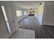 Inviting living room featuring wood-look flooring and a view of the outdoors at 12809 Wedgewood Way # A, Hudson, FL 34667