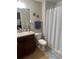 Bathroom featuring a shower with modern fixtures and a granite countertop vanity at 1438 Mallory Sail Pl, Brandon, FL 33511