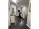 Hallway featuring dark wood floors and an exercise bike at 1438 Mallory Sail Pl, Brandon, FL 33511