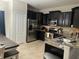 Kitchen featuring dark wood cabinets, stainless steel appliances, and granite countertops at 1438 Mallory Sail Pl, Brandon, FL 33511