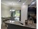 Open kitchen with dark wood cabinets, stainless steel appliances, granite countertops and eat-in dining at 1438 Mallory Sail Pl, Brandon, FL 33511