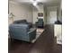 Bright living room featuring stylish sofas, neutral color palette, and hardwood flooring at 1438 Mallory Sail Pl, Brandon, FL 33511