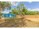Blue house with white trim, and a large yard at 1513 Escort Ave, Tampa, FL 33610