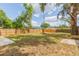 Large backyard with a wooden fence and ample space at 1513 Escort Ave, Tampa, FL 33610