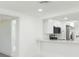Modern kitchen featuring white cabinetry, quartz countertops, and stainless steel appliances at 1513 Escort Ave, Tampa, FL 33610