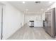Bright kitchen features stainless steel appliances, white cabinets, and modern countertops at 1513 Escort Ave, Tampa, FL 33610
