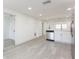 Bright kitchen features stainless steel appliances, white cabinets, and modern countertops at 1513 Escort Ave, Tampa, FL 33610