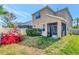 Backyard featuring sparse grass and a screened-in porch attached to the house at 16717 Myrtle Sand Dr, Wimauma, FL 33598