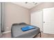 Bedroom featuring a full bed, neutral colors and an ample closet at 16717 Myrtle Sand Dr, Wimauma, FL 33598