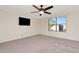 Spacious bedroom with ceiling fan and natural light, perfect for creating a relaxing retreat at 16717 Myrtle Sand Dr, Wimauma, FL 33598