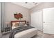 Bedroom featuring a large bed, neutral colors and an ample closet at 16717 Myrtle Sand Dr, Wimauma, FL 33598