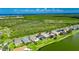 Waterfront properties, lush greenery, and serene setting for a tranquil living experience at 1806 Mira Lago Cir, Ruskin, FL 33570