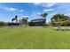 Spacious backyard with privacy fence, perfect for outdoor activities and relaxation at 1806 Mira Lago Cir, Ruskin, FL 33570