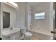 A well-lit full bathroom with a sink, toilet, and bathtub with shower at 1806 Mira Lago Cir, Ruskin, FL 33570