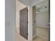 A view from a doorway into the bathroom, which shows the flooring and bathroom fixtures at 1806 Mira Lago Cir, Ruskin, FL 33570