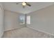 Bedroom with a ceiling fan and a window with blinds at 1806 Mira Lago Cir, Ruskin, FL 33570