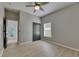 Bedroom featuring gray walls, wood-look floors, ceiling fan, closet, and natural light at 1806 Mira Lago Cir, Ruskin, FL 33570
