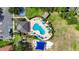 Bird's eye view of community pool, clubhouse, tennis court and playground amenities in a residential area at 1806 Mira Lago Cir, Ruskin, FL 33570