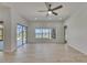 The living room has wood-look floors, bright walls, and a beautiful pool-side view at 1806 Mira Lago Cir, Ruskin, FL 33570