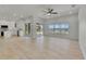 Bright, open living room features recessed lighting, ceiling fan, and a stunning water view from the large window at 1806 Mira Lago Cir, Ruskin, FL 33570