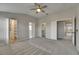 Large main bedroom with walk-in closets, ensuite bath, and neutral carpet at 1806 Mira Lago Cir, Ruskin, FL 33570